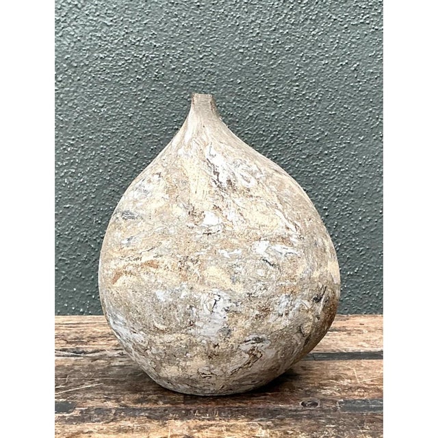 This vintage ceramic vase presents a beautifully sculptural, bulbous silhouette that tapers gracefully upward into a...