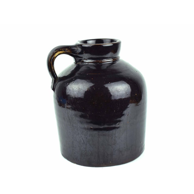 Elevate your interior with this authentic 19th-century American stoneware jug, a premier example of antique primitive...
