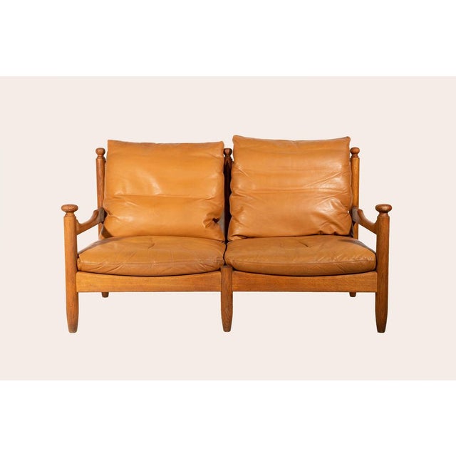 A midcentury modern Brutalist two seat sofa in the style of Guillerme et Chambron. A typical French 50s style and...