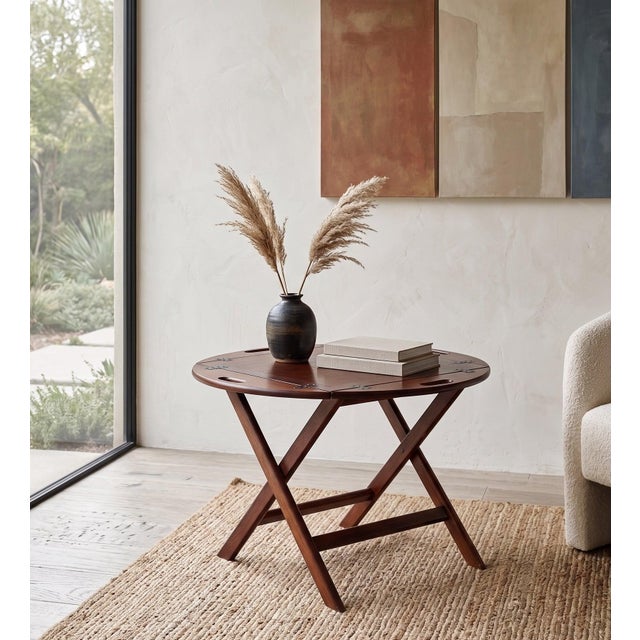 Elegant folding tray table in mahogany, produced in the 1950s. A practical and versatile piece that can be used as a...