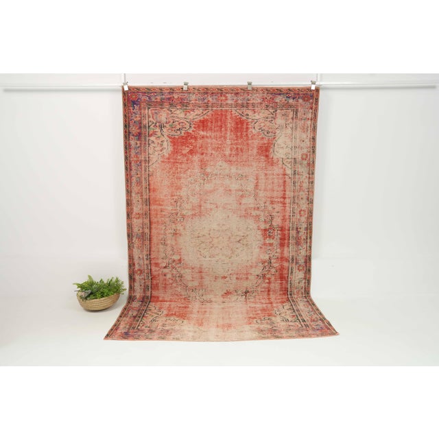 Vintage Hand-Knotted runner rug is a semi-antique vintage area rug. The '70s Eastern region of Anatolia's unique rug is...