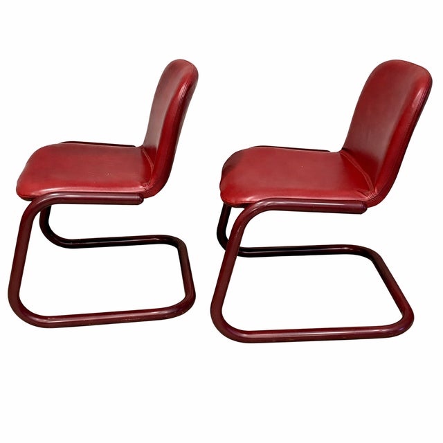 A striking set of four postmodern cantilever dining chairs designed and manufactured by Kinetics Furniture in the late...