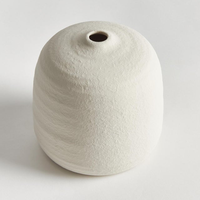 A classic rotund shape and a very narrow opening makes this vase perfect for a single branch or tall faux floral stem. The...
