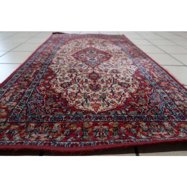 Vintage Indian Rug: Immerse yourself in the cultural richness of our Vintage Indian Rug, originating from the 1970s....