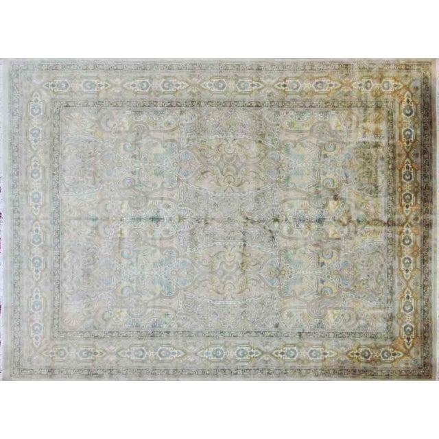 A classical design of swaying palmettes and tendrils emanates from a central blossom. The consistent tone-on-tone...