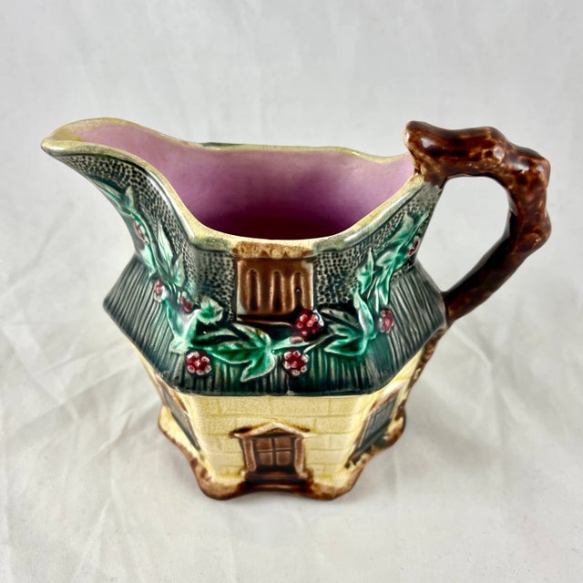 An English majolica pitcher shaped as a country cottage, by Warrilow & Cope – Wellington Pottery Works, Longton, Stoke-on-...