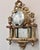 Unique wall decor. Antique French gilt wood clock housing with convex glass front refinished with a mercury glass mirrored...