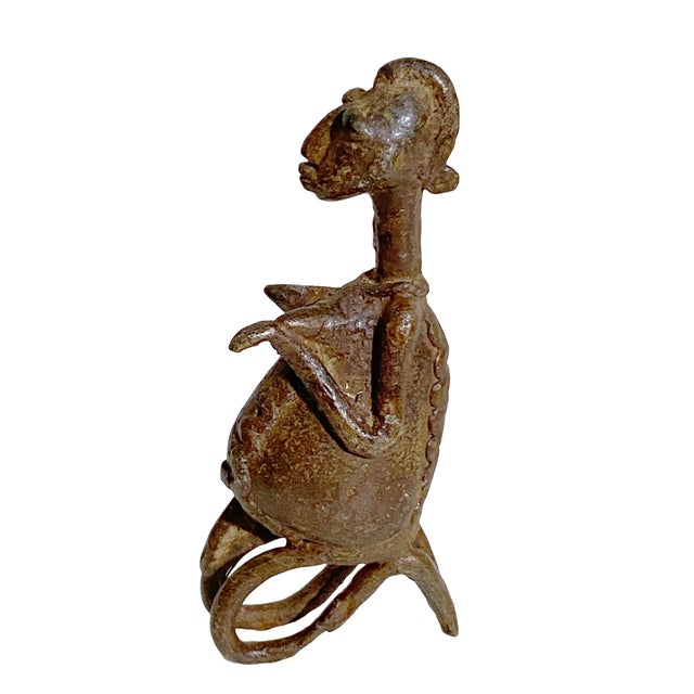 This exceptional vintage Maternity Dogon bronze from Mali Cast using the ancient lost-wax (Cire Perdue) technique, the...