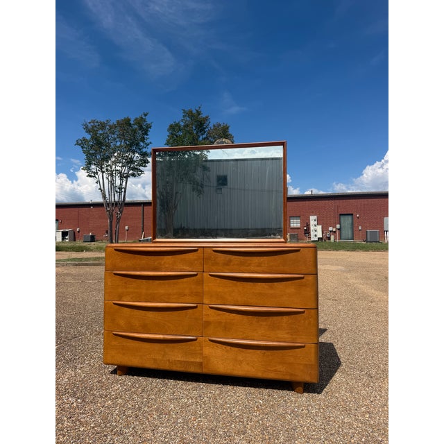 A beautifully sculpted vintage Heywood-Wakefield Encore dresser with the clean lines, warm wood tones, and sophisticated...