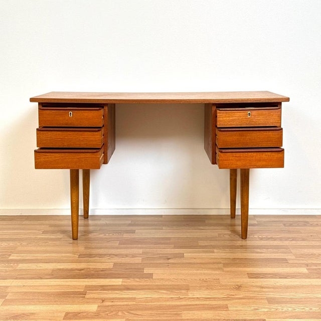 Writing desk was manufactured in Denmark in the 1950s-60s. It is made of teak wood and veneered on the top surface, the...