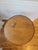 Antique round oak parlor or occasional table dating to the early 20th century. The table features a scalloped molded top...
