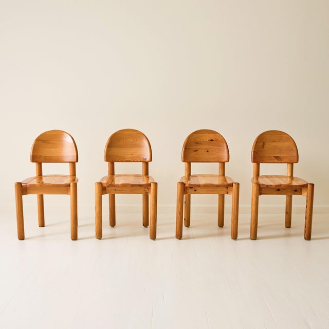 Set of four dining chairs by Rainer Daumiller, crafted in solid pine. Known for his organic, sculptural approach to...