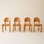 Set of four dining chairs by Rainer Daumiller, crafted in solid pine. Known for his organic, sculptural approach to...