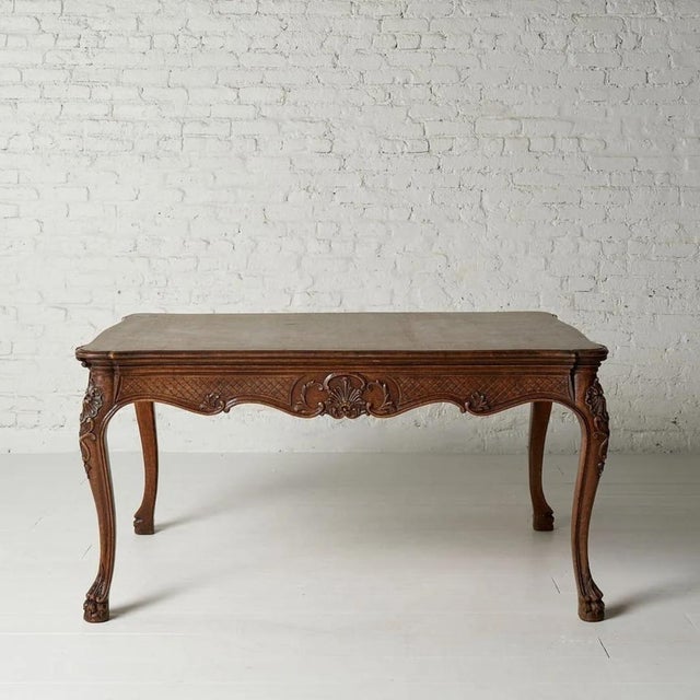 This exquisite 20th Century Belgian Oak Dining Table embodies timeless European elegance with its beautifully carved...