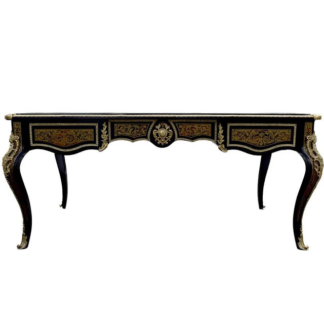 This Antique Style French Large Boulle style Marquetry Desk is a stunning piece of furniture with a classic and elegant...