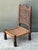 This stunning vintage low weaver’s chair is a masterclass in folk art craftsmanship and global design. Featuring an...