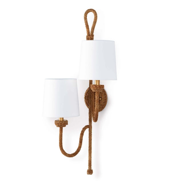 Natural woven rattan provides a "washed ashore" look on the Bimini sconce. Looped detailing also provides a nautical...