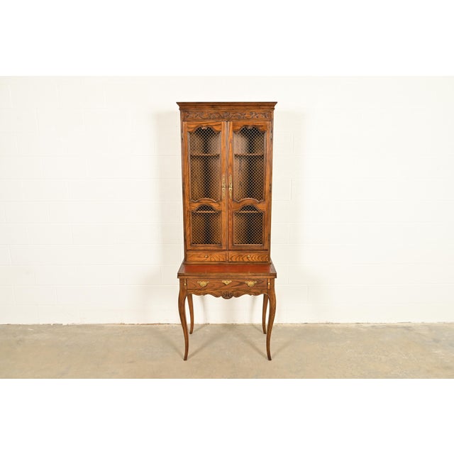An exceptional French Provincial Louis XV style secretary desk with bookcase hutch By Baker Furniture USA, Circa 1960s...