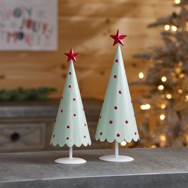 Add a playful pop of retro charm to your holiday décor with this set of two mint metal Christmas trees, designed to bring...