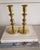 A classic pair of solid brass candlesticks by Baldwin, marked Forged in America. These candlesticks feature a timeless...