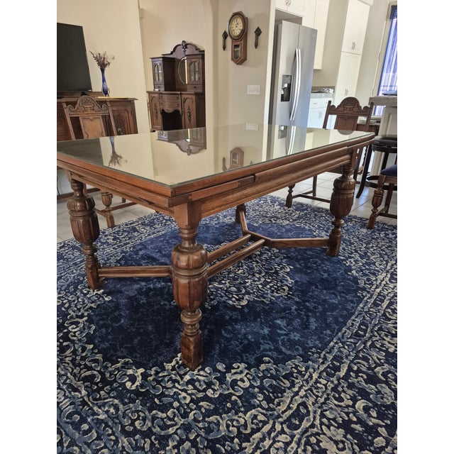 Tudor Revival / Jacobean Style: The set draws heavily from 16th and 17th-century English designs. The legs feature bulbous...