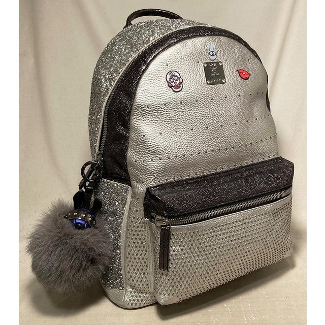 MCM Special Edition Silver Leather Swarovski Crystal Backpack with Rabbit Charm in excellent condition. Silver leather...