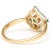Emeralds and diamonds gleam in a distinct pattern from the center of this splendid geometric ring. Brightly colored yellow...