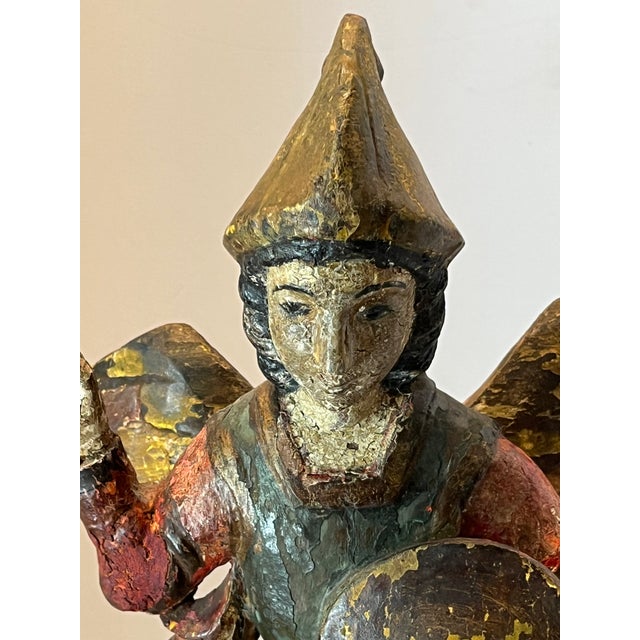 18th Century Spanish Polychrome Wood Carving of St. Michael Magnificent polychrome carved wooden sculpture representing...