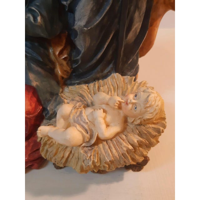 Enhance your holiday decor with this charming three-figurine set featuring Mary, Joseph, and Baby Jesus. This beautifully...