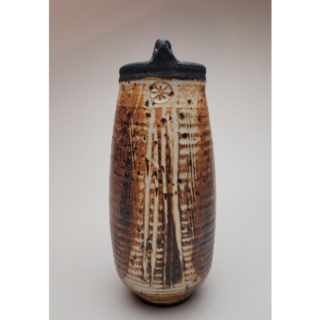 Superb example of a 'Bird Head' design vase by Vivika and Otto Heino. The surface of this wood fired glazed stoneware...