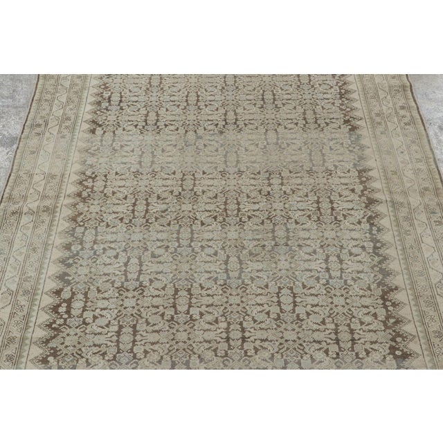 Hand-knotted in wool, this 4x6 Persian Malayer rug embodies a refined and understated expression of tribal elegance....