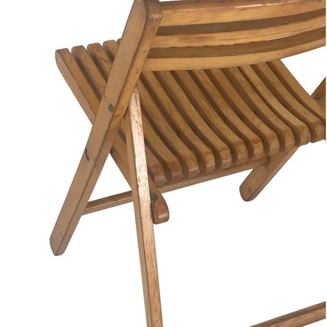 Foldable wooden chair. Formerly used by circuses and theaters. Lightweight and sturdy. This version is made from lacquered...