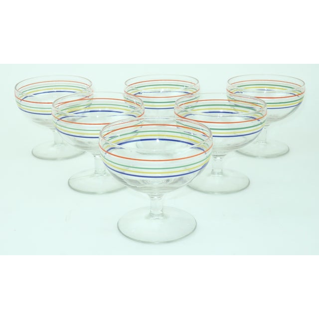 It's happy hour with a whimsical set of six 1950's cocktail glasses embellished with horizontal stripes in the primary...