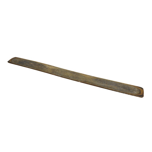 Circa early 20th century hand-hewn long, skinny wooden trencher or dough bowl. Dimensions: 41.5" x 3.75" x 1.25" (Width x...