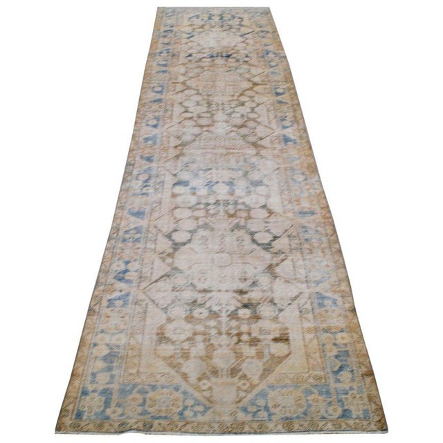 Hand-knotted with care using traditional rug-making techniques, this wool rug blends timeless craftsmanship with a modern...