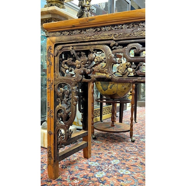 large antique Chinese altar table measures 77 1/2 by 36 by 17 1/2 inches and features finely carved and gilt designs along...