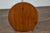 An English pine cricket table from the 19th century with circular top, tripod base and triangular low shelf. This English...