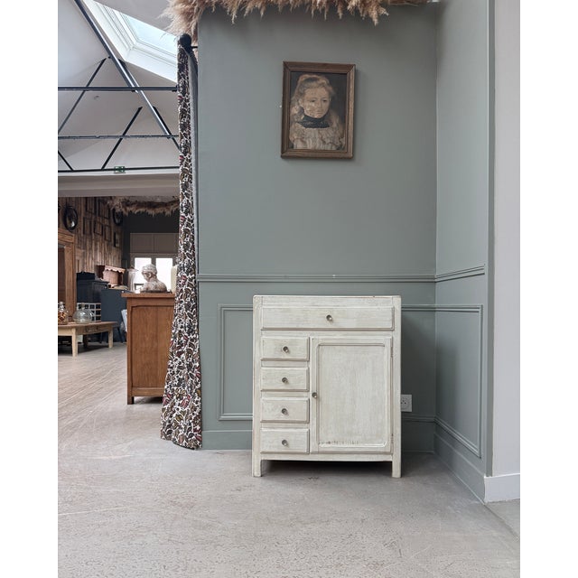 Charming small parisian sideboard dating from the 1930s-1940s, recognizable by its asymmetrical front and ample storage....