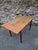 Vintage French pine table dating from the 1930s. This lightweight table features turned beech legs and a solid pine top...