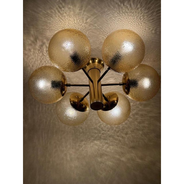 These gorgeous chandeliers were originally from a 1960s dance hall, and they hung there until recently. The textured glass...
