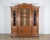 A grand French bookcase in solid walnut, dating to the late 19th century, showcasing both elegance and durability. The...