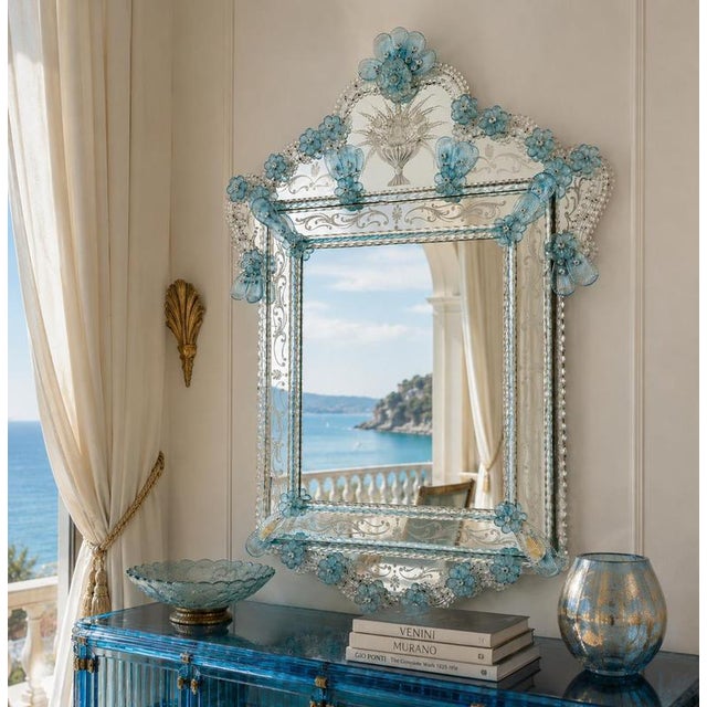 Venetian Mirror with Light Blue Murano Glass Floral Decoration Murano, Venice, Italy, Mid-20th Century An elegant...