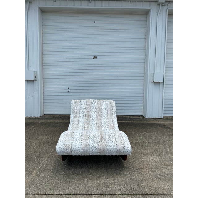 The Adrian Pearsall rocking "Wave" chaise lounge fully reupholstered in an Ana Elisabeth S5443 Arctic faux fur fabric. The...