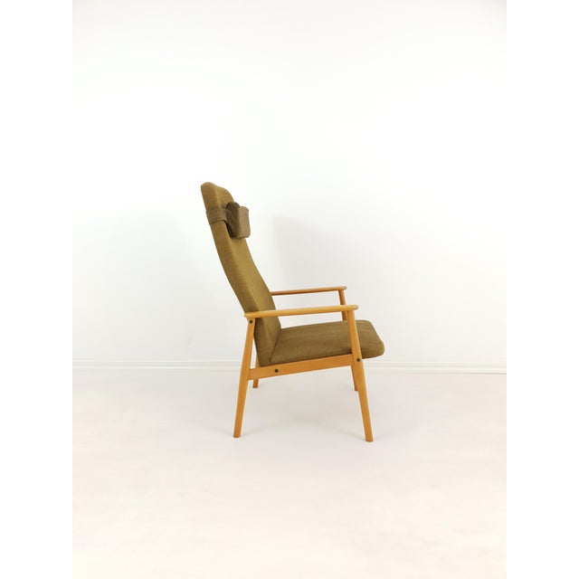 This armchair was manufactured in Sweden in 1970s. It comes in solid beech frame and original upholstery.