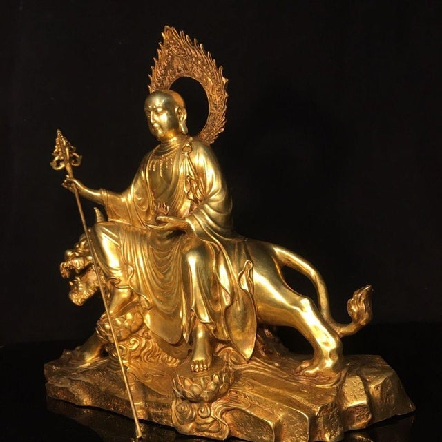This is a large and impressive antique gilt bronze sculpture of Ksitigarbha Bodhisattva, a revered figure in Buddhism. The...