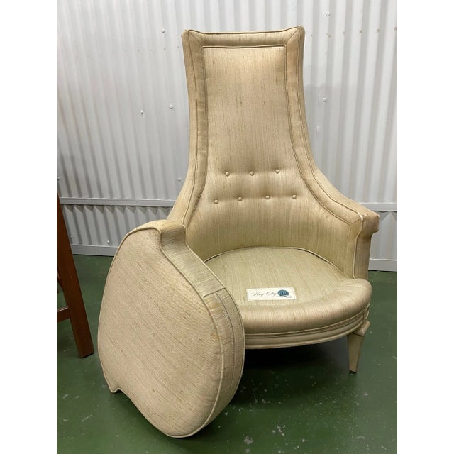 Glam Hollywood Regency high back chair in original upholstery. The low arm swoops up to a high back that features tufting...