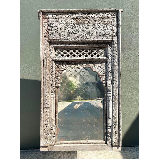 This monumental architectural mirror captures the timeless elegance of traditional Indian craftsmanship. The hand-carved...