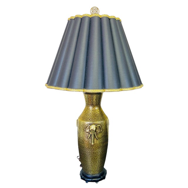 Add a touch of exotic flair to your home decor with this stunning pair of Mid-20th Century Gold Porcelain Elephant Head...