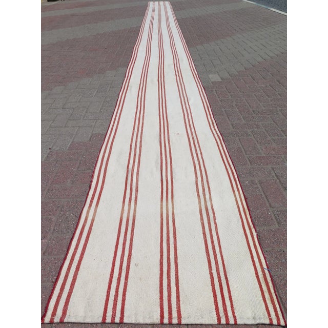 This beautiful extra long runner rug is from westhern of Turkey Afion. About 60 years old. It is handmade with cotton...