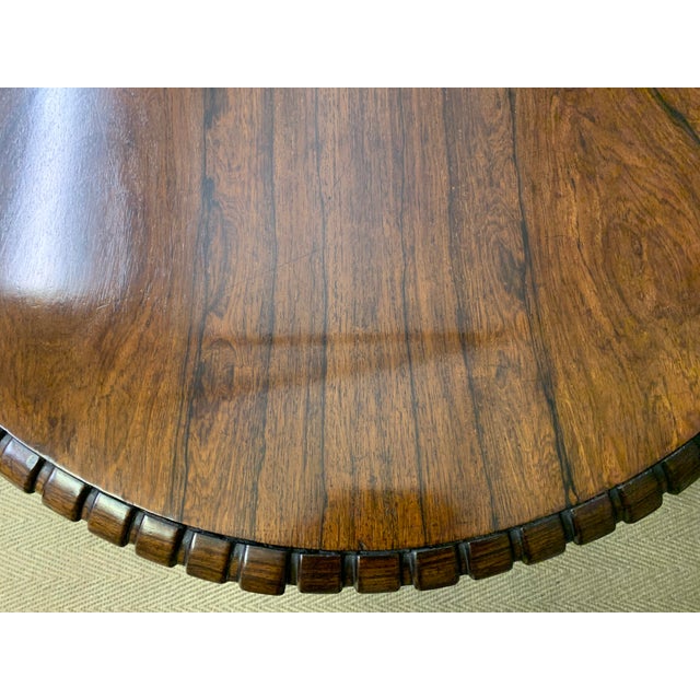 A superb late Regency period centre, or breakfast table. Very well constructed in solid rosewood with attractive rosewood...